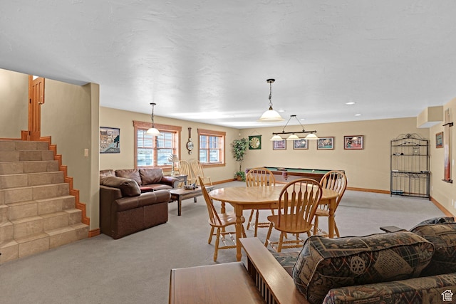 315 S Bear Lake Blvd, Garden City, UT 84028 - dining room featuring light colored carpet, baseboards, and stairway