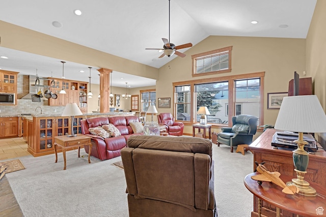 315 S Bear Lake Blvd, Garden City, UT 84028 - living room featuring decorative columns, ceiling fan, plenty of natural light, recessed lighting, and light colored carpet