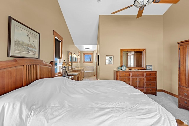 315 S Bear Lake Blvd, Garden City, UT 84028 - bedroom with light carpet, baseboards, connected bathroom, and ceiling fan