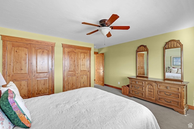 315 S Bear Lake Blvd, Garden City, UT 84028 - bedroom with carpet flooring, two closets, baseboards, and a ceiling fan