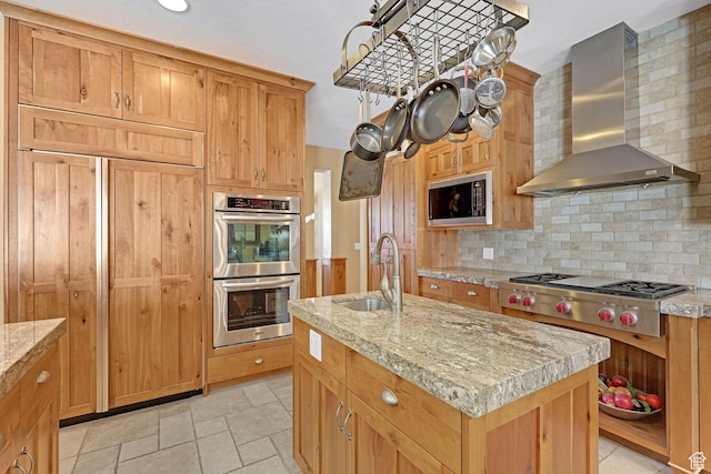 315 S Bear Lake Blvd, Garden City, UT 84028 - kitchen with wall chimney range hood, stainless steel appliances, a sink, backsplash, and a kitchen island with sink