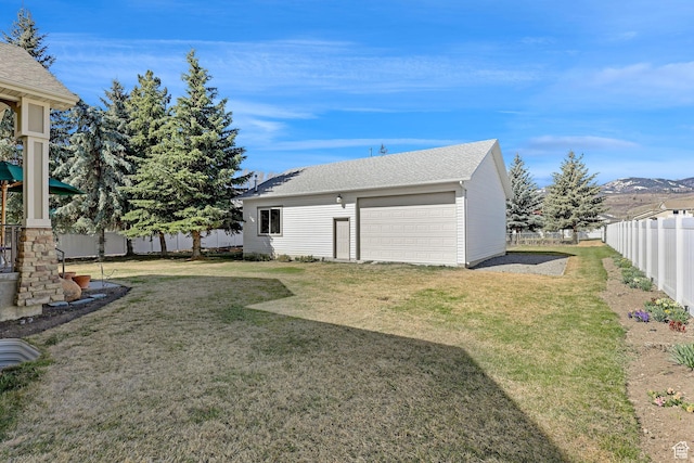 315 S Bear Lake Blvd, Garden City, UT 84028 - view of yard featuring an outdoor structure, a detached garage, and a mountain view