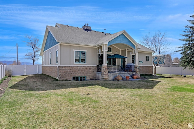 315 S Bear Lake Blvd, Garden City, UT 84028 - rear view of house featuring a gate, a chimney, roof with shingles, brick siding, and board and batten siding