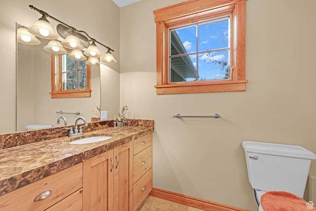 315 S Bear Lake Blvd, Garden City, UT 84028 - bathroom with toilet, baseboards, and vanity