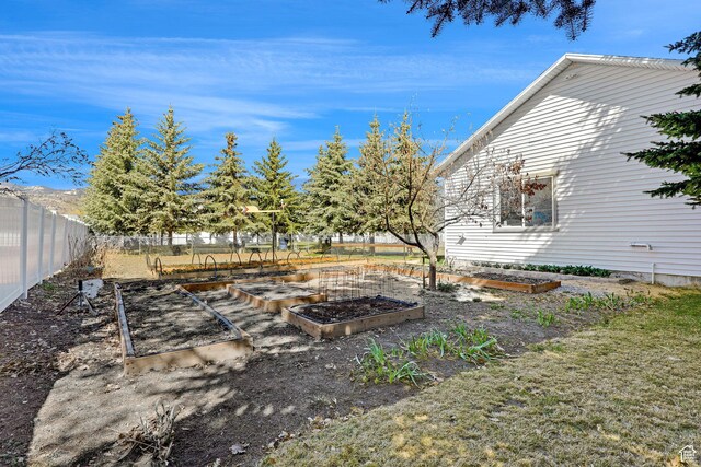 315 S Bear Lake Blvd, Garden City, UT 84028 - view of yard with a garden and fence
