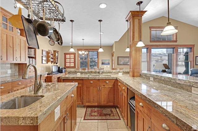 315 S Bear Lake Blvd, Garden City, UT 84028 - kitchen with a sink, hanging light fixtures, light tile patterned floors, and lofted ceiling