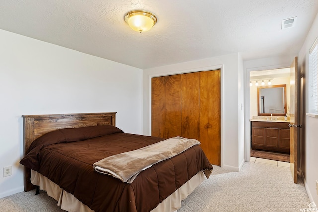 712 S 6150 W, Ogden, UT 84404 - carpeted bedroom with a textured ceiling, ensuite bathroom, and a closet