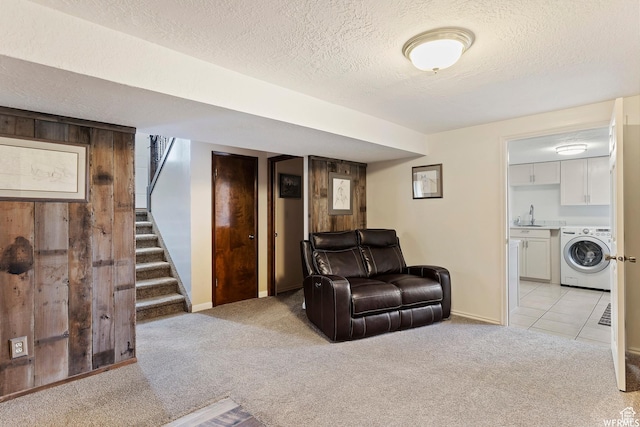 712 S 6150 W, Ogden, UT 84404 - carpeted living room with sink, wooden walls, washer / clothes dryer, and a textured ceiling