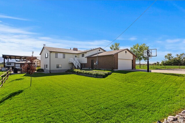 712 S 6150 W, Ogden, UT 84404 - rear view of house with a yard