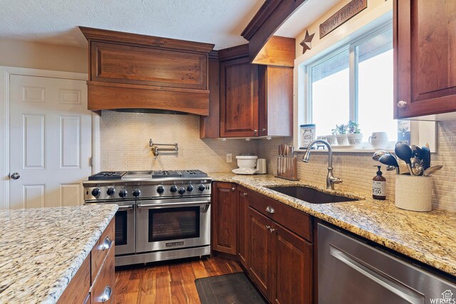 712 S 6150 W, Ogden, UT 84404 - kitchen featuring sink, stainless steel appliances, light stone counters, and tasteful backsplash
