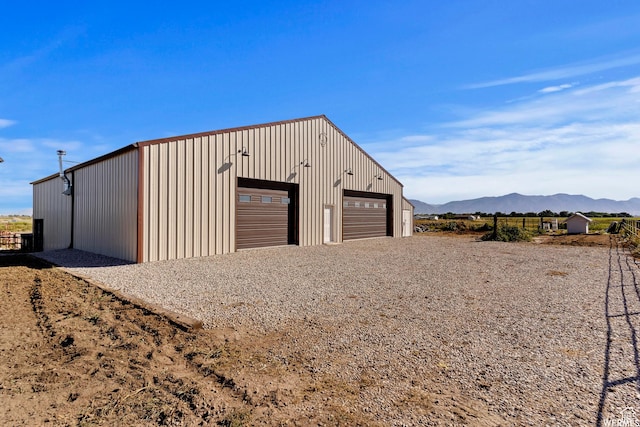 712 S 6150 W, Ogden, UT 84404 - garage featuring a mountain view