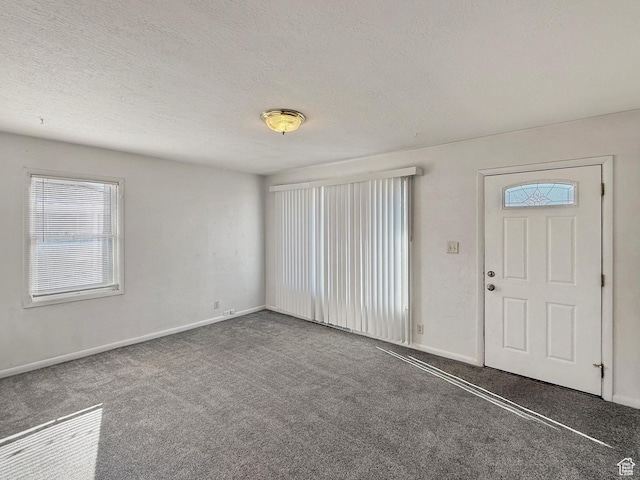 5840 S 2625 W, Roy, UT 84067 - foyer with baseboards, carpet floors, and a textured ceiling