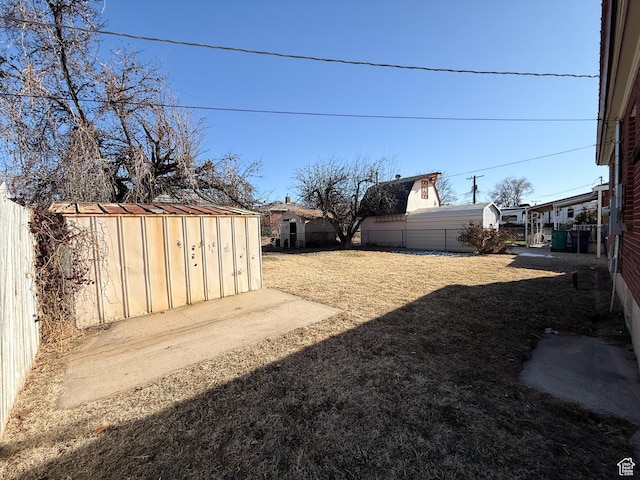 5840 S 2625 W, Roy, UT 84067 - view of yard featuring an outbuilding, a fenced backyard, and a storage shed