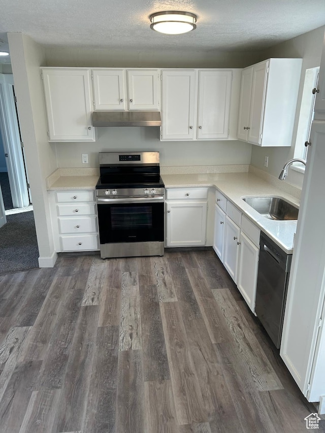 kitchen with dark hardwood / wood-style floors, sink, white cabinets, stainless steel appliances, and a textured ceiling