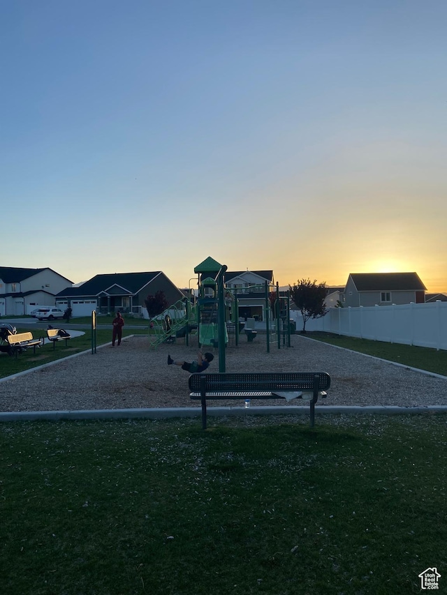 422 W 1360 N, Tooele, UT 84074 - playground at dusk featuring a lawn