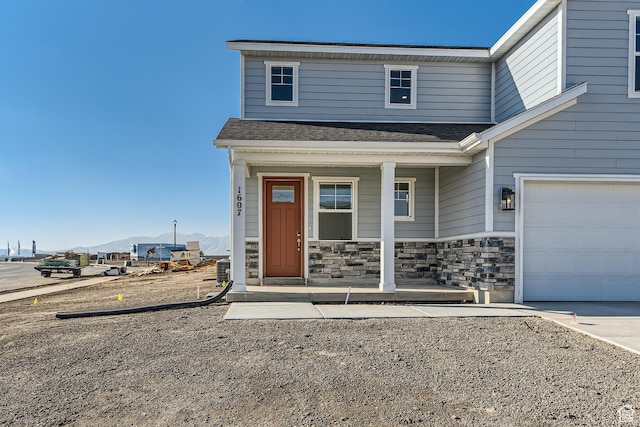 view of front of home featuring a garage and covered porch