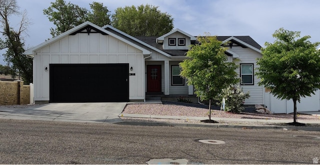 3 W 825 S, Willard, UT 84340 - view of front of property with board and batten siding, driveway, a garage, and a shingled roof