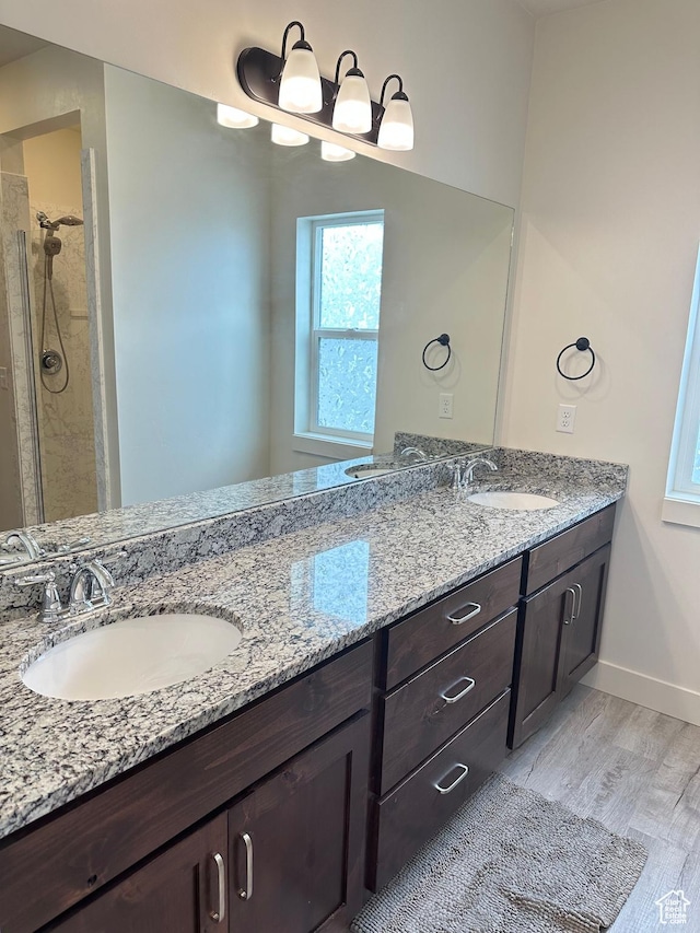 3 W 825 S, Willard, UT 84340 - full bathroom with wood finished floors, double vanity, baseboards, and tiled shower
