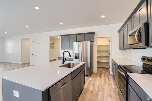 1617 N 800 W, Salem, UT 84653 - kitchen featuring stainless steel appliances, a sink, light wood-type flooring, light countertops, and recessed lighting
