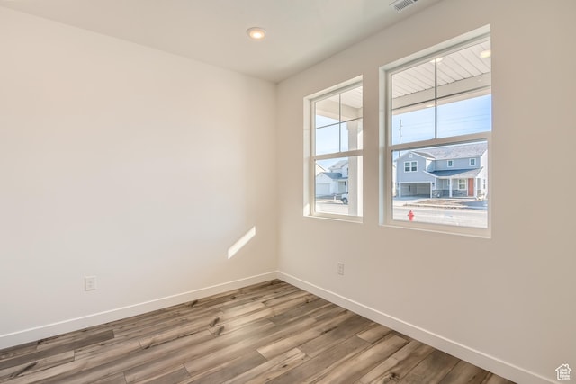 1639 N 800 W, Salem, UT 84653 - unfurnished room with baseboards, wood finished floors, and recessed lighting