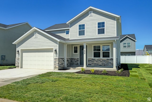 1639 N 800 W, Salem, UT 84653 - view of front of home with covered porch, a garage, driveway, and stone siding