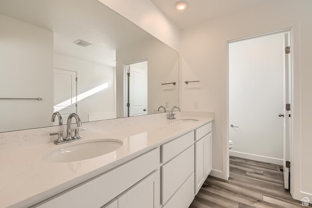 1639 N 800 W, Salem, UT 84653 - bathroom with toilet, double vanity, wood finished floors, and recessed lighting