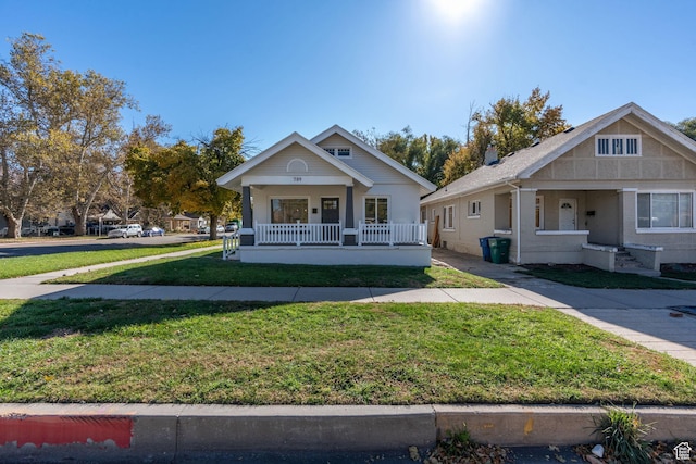 789 27th St, Ogden, UT 84403 - view of front facade featuring a porch and a front yard