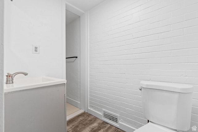 789 27th St, Ogden, UT 84403 - bathroom featuring wood-type flooring, vanity, and toilet