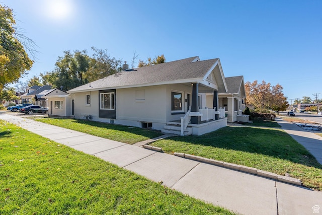 view of front of home with a front lawn and a porch