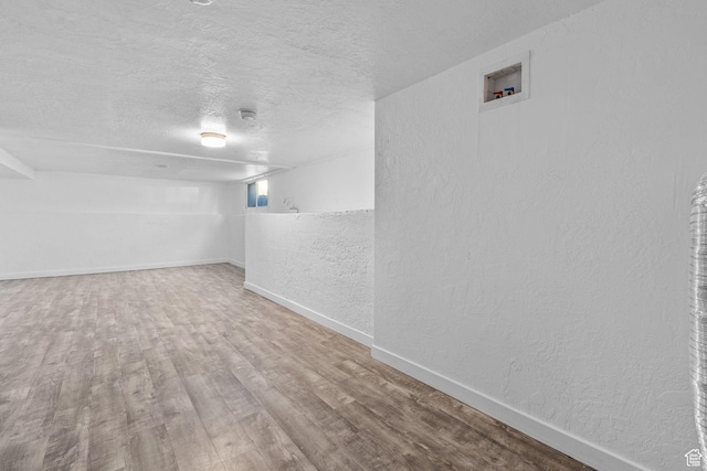 789 27th St, Ogden, UT 84403 - basement featuring hardwood / wood-style floors and a textured ceiling