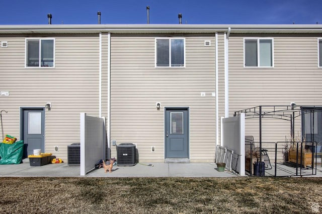 2460 W 450 N # 10, Tremonton, UT 84337 - rear view of property featuring cooling unit, a yard, and a patio