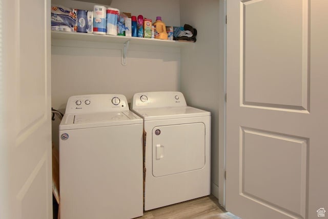 2460 W 450 N # 10, Tremonton, UT 84337 - clothes washing area with washing machine and dryer and light wood-type flooring