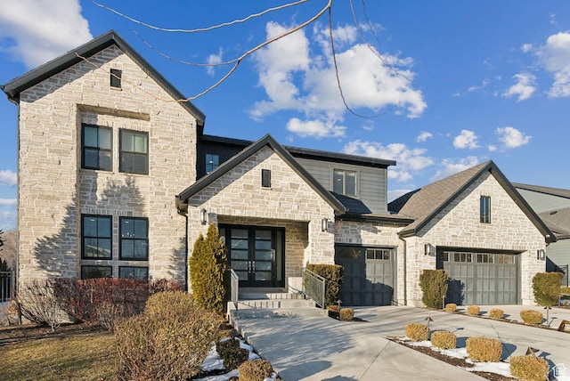 2905 E Denmark Dr, Cottonwood Heights, UT 84121 - view of front facade featuring driveway, french doors, an attached garage, and stone siding