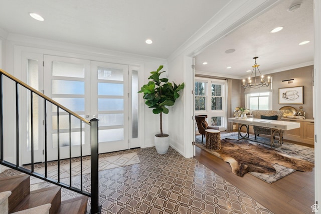 2905 E Denmark Dr, Cottonwood Heights, UT 84121 - foyer featuring recessed lighting, an inviting chandelier, baseboards, stairway, and crown molding