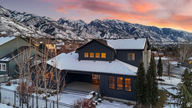 2905 E Denmark Dr, Cottonwood Heights, UT 84121 - snow covered house featuring a mountain view and fence