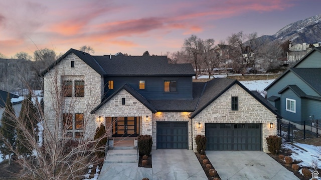 2905 E Denmark Dr, Cottonwood Heights, UT 84121 - view of front facade with fence, a shingled roof, concrete driveway, and stone siding