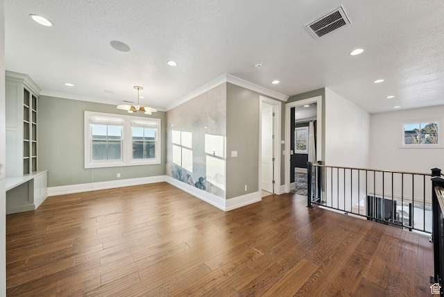 2905 E Denmark Dr, Cottonwood Heights, UT 84121 - spare room featuring wood finished floors, visible vents, recessed lighting, and a notable chandelier