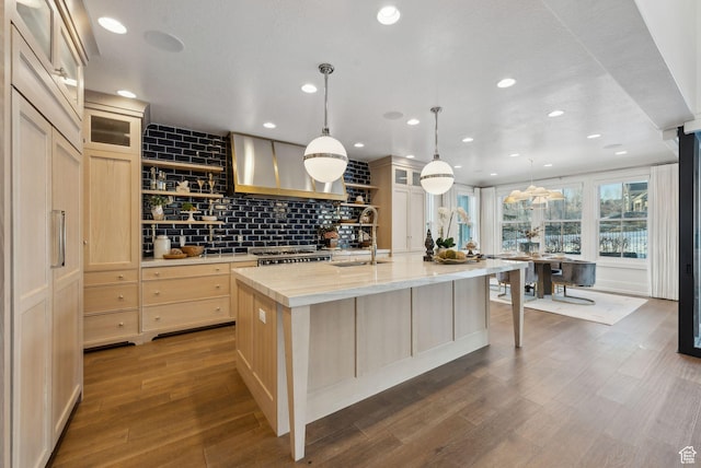 2905 E Denmark Dr, Cottonwood Heights, UT 84121 - kitchen with a sink, a kitchen island with sink, open shelves, and wall chimney exhaust hood