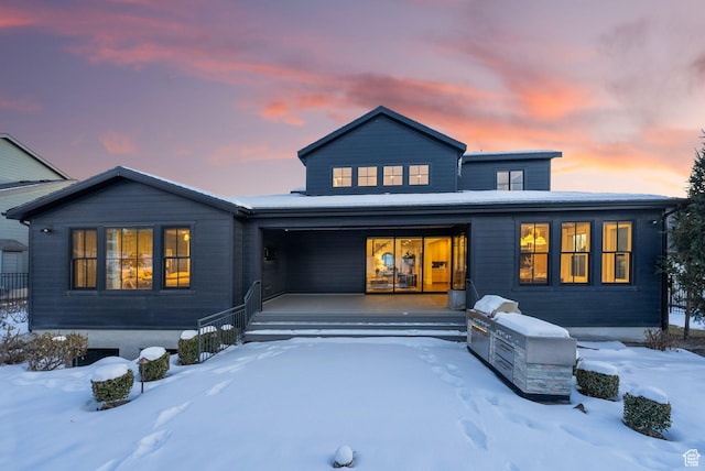 2905 E Denmark Dr, Cottonwood Heights, UT 84121 - snow covered back of property with a porch