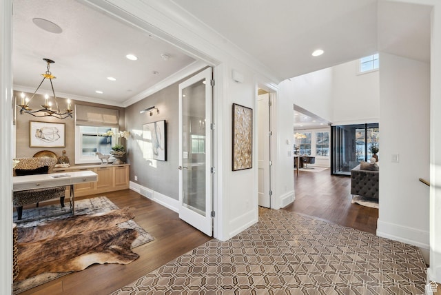 2905 E Denmark Dr, Cottonwood Heights, UT 84121 - corridor with dark wood finished floors, a notable chandelier, and plenty of natural light