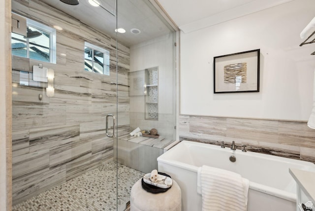 2905 E Denmark Dr, Cottonwood Heights, UT 84121 - full bathroom with tile walls, a stall shower, and a freestanding bath