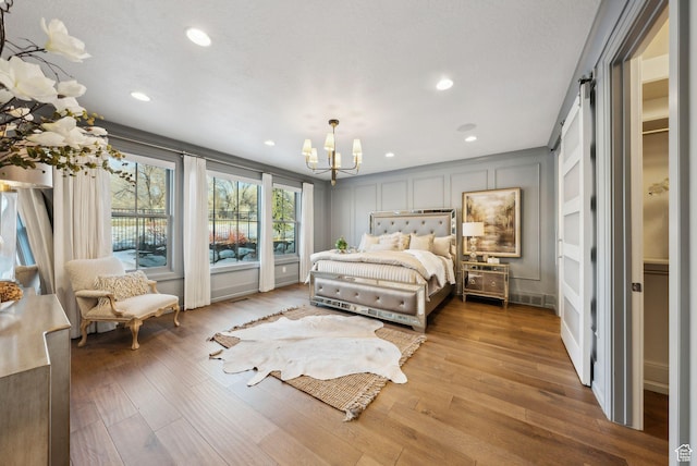 2905 E Denmark Dr, Cottonwood Heights, UT 84121 - bedroom with recessed lighting, wood finished floors, and a chandelier