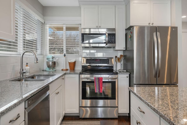 3655 E Oak Rim Way, Millcreek, UT 84109 - kitchen with white cabinetry, sink, light stone counters, and stainless steel appliances