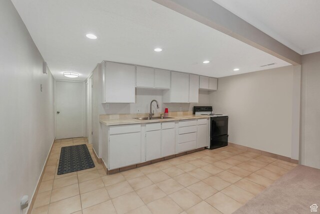 3655 E Oak Rim Way, Millcreek, UT 84109 - kitchen with sink, light tile patterned floors, range with electric cooktop, and white cabinets