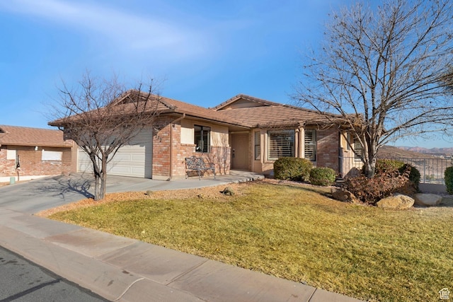 ranch-style home with concrete driveway, an attached garage, and brick siding