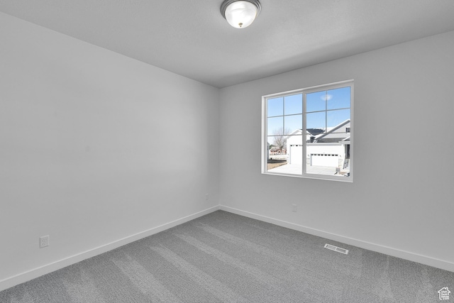 1162 N 375th St W Unit 22, Harrisville, UT 84404 - carpeted spare room with visible vents and baseboards