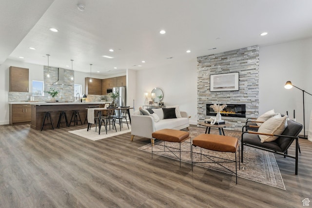 1618 S Main St Unit 2, Salt Lake City, UT 84115 - living room featuring sink, dark wood-type flooring, and a fireplace
