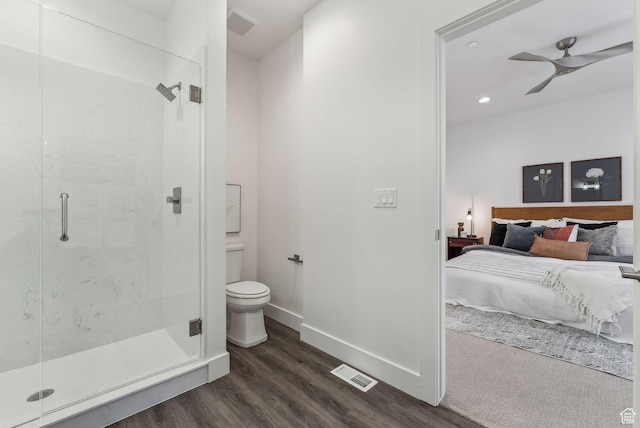 1618 S Main St Unit 2, Salt Lake City, UT 84115 - bathroom featuring ceiling fan, toilet, a shower with shower door, and hardwood / wood-style floors