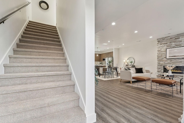 1618 S Main St Unit 2, Salt Lake City, UT 84115 - stairway with hardwood / wood-style flooring and a fireplace