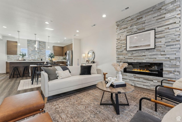 1618 S Main St Unit 2, Salt Lake City, UT 84115 - living room with dark hardwood / wood-style flooring and a stone fireplace